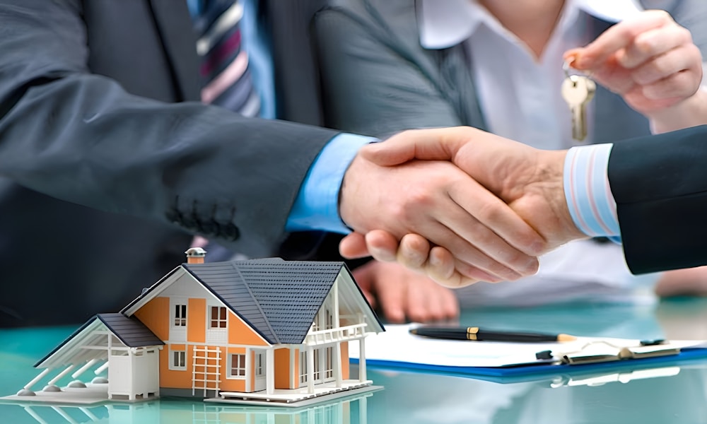 Real estate professionals shaking hands